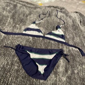 Two piece bathing suit size medium, blue and white striped with green stitching
